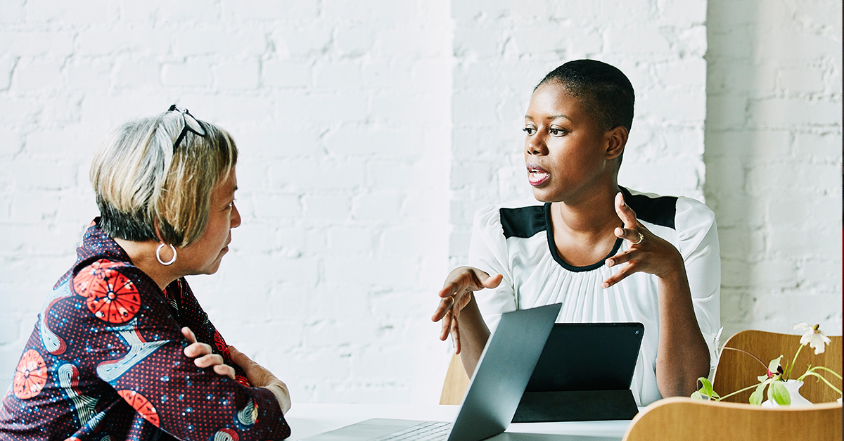 Two businesswomen in a casual meeting.