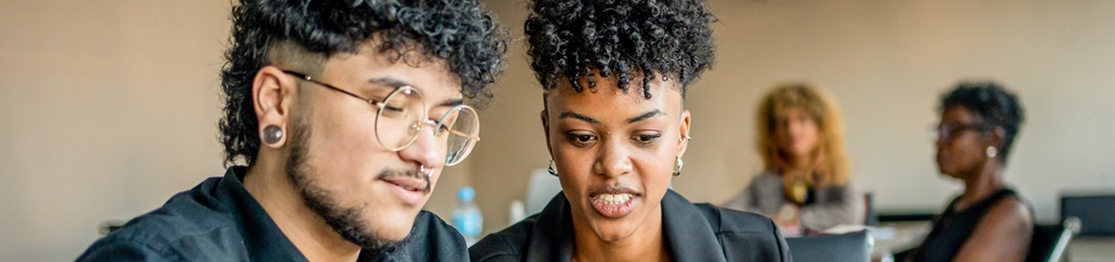 Two coworkers in a business meeting.